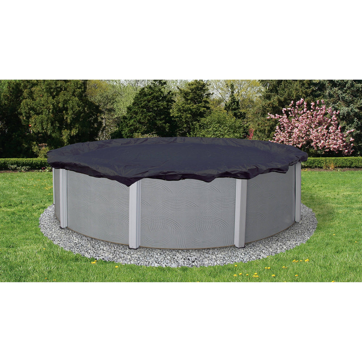 Arctic Armor 8-Year Above Ground Winter Cover - navy cover fitted over a round above-ground pool in a garden