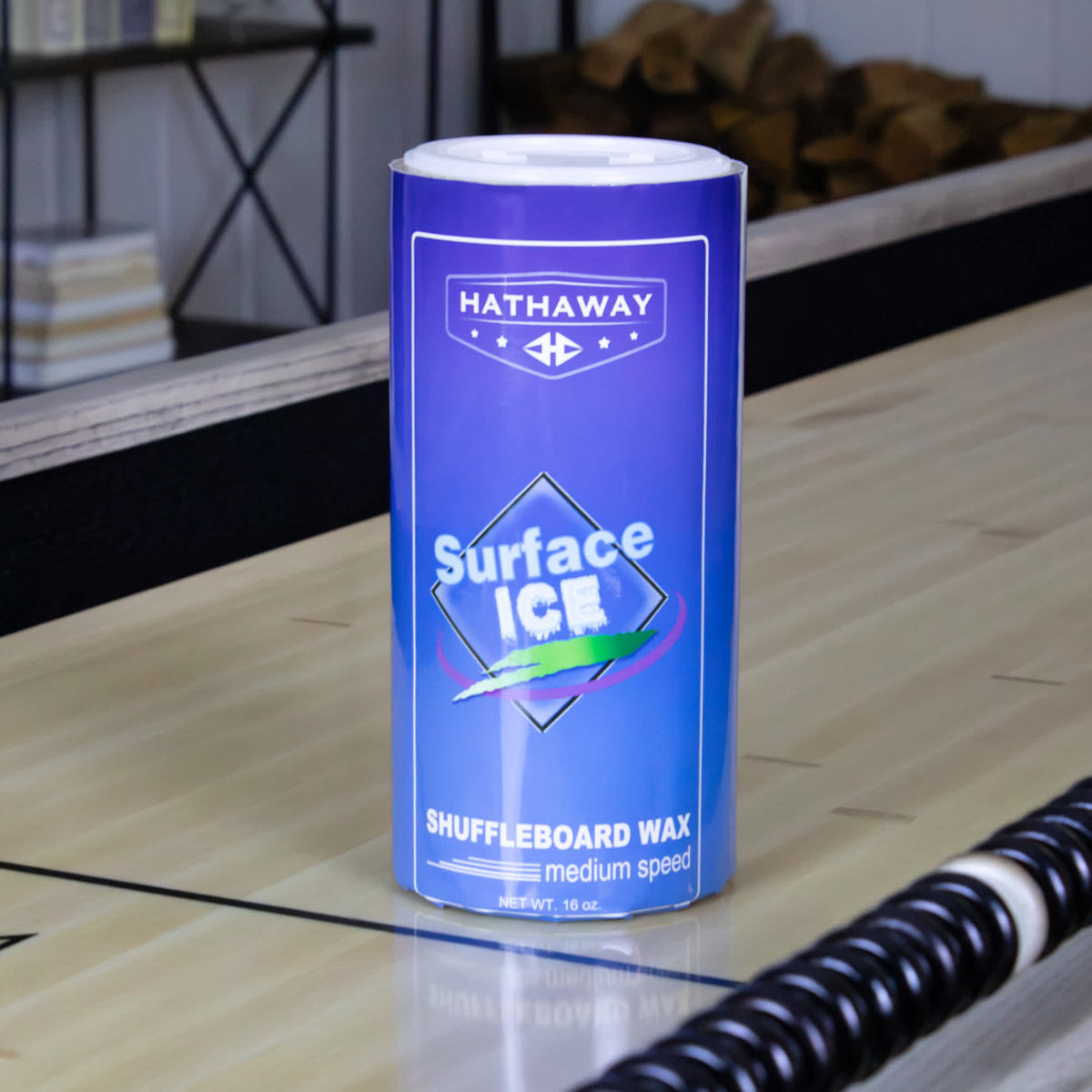 Hathaway Surface Ice Shuffleboard Wax - 16-oz medium speed can standing on the playfield