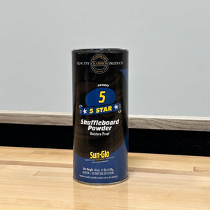 Sun Glo Shuffleboard Powder - 16-oz speed 5 can standing on a maple shuffleboard playfield